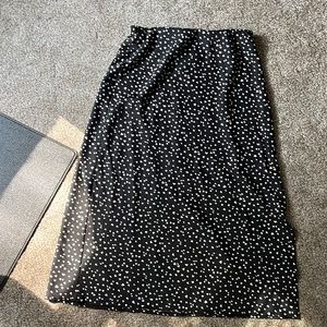 Black with white heart, midi skirt. Slit on the side. Size Med. only worn once.